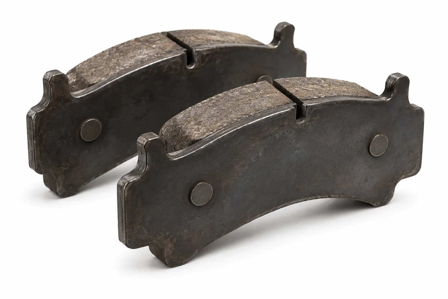 Image 2: AI-generated representative commercial brake pads, friction-face view; not the actual used pads.