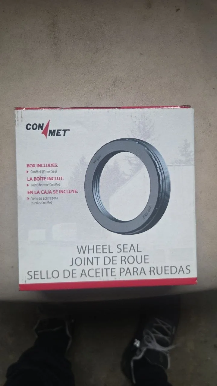 Image 6: Shop-supplied photo of the front of the ConMet wheel seal box; printed seal image is packaging art, not a photo of the used item.
