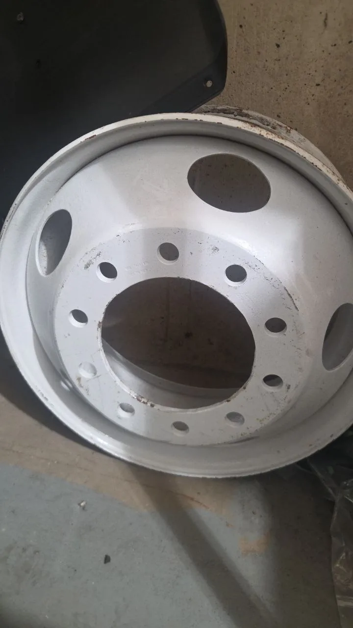 Original shop photo of used silver 10-lug Volvo truck rim. Wheel material, size, part number and fitment are not verified.