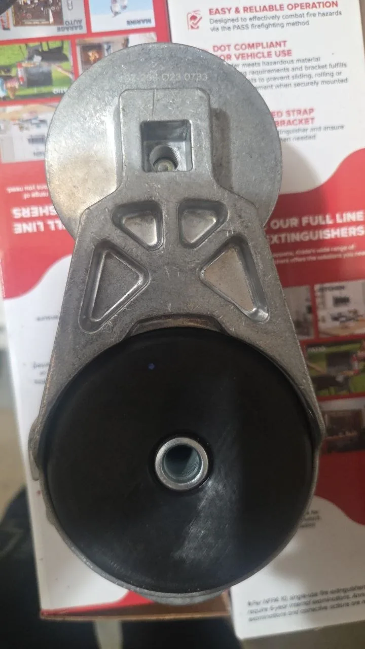 Shop-supplied photo of the actual tensioner assembly identified for Volvo VNL; manufacturer, part number and exact fitment are unverified.